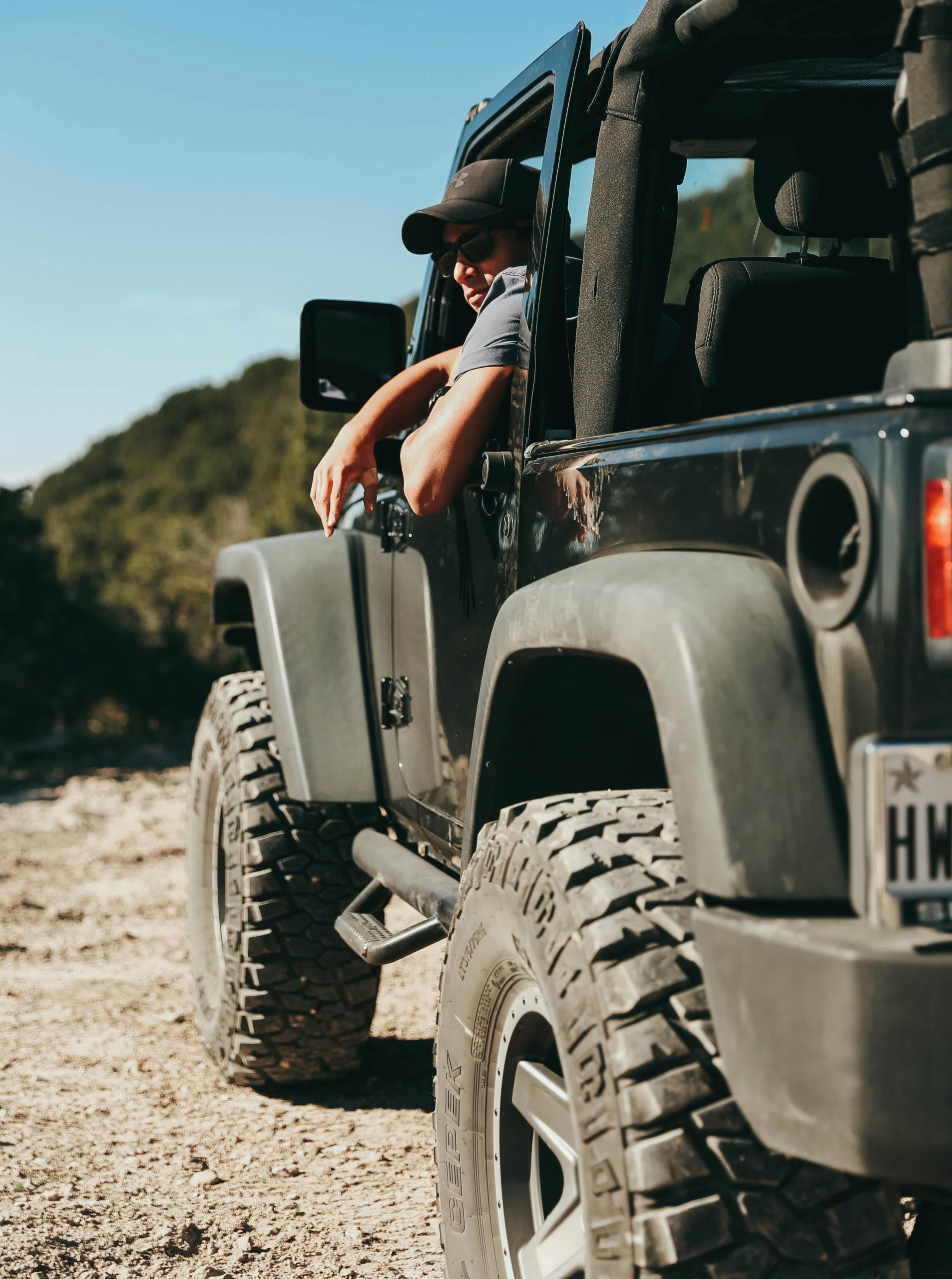 Man explores rugged Texas terrain in a Jeep, capturing the spirit of outdoor adventure.